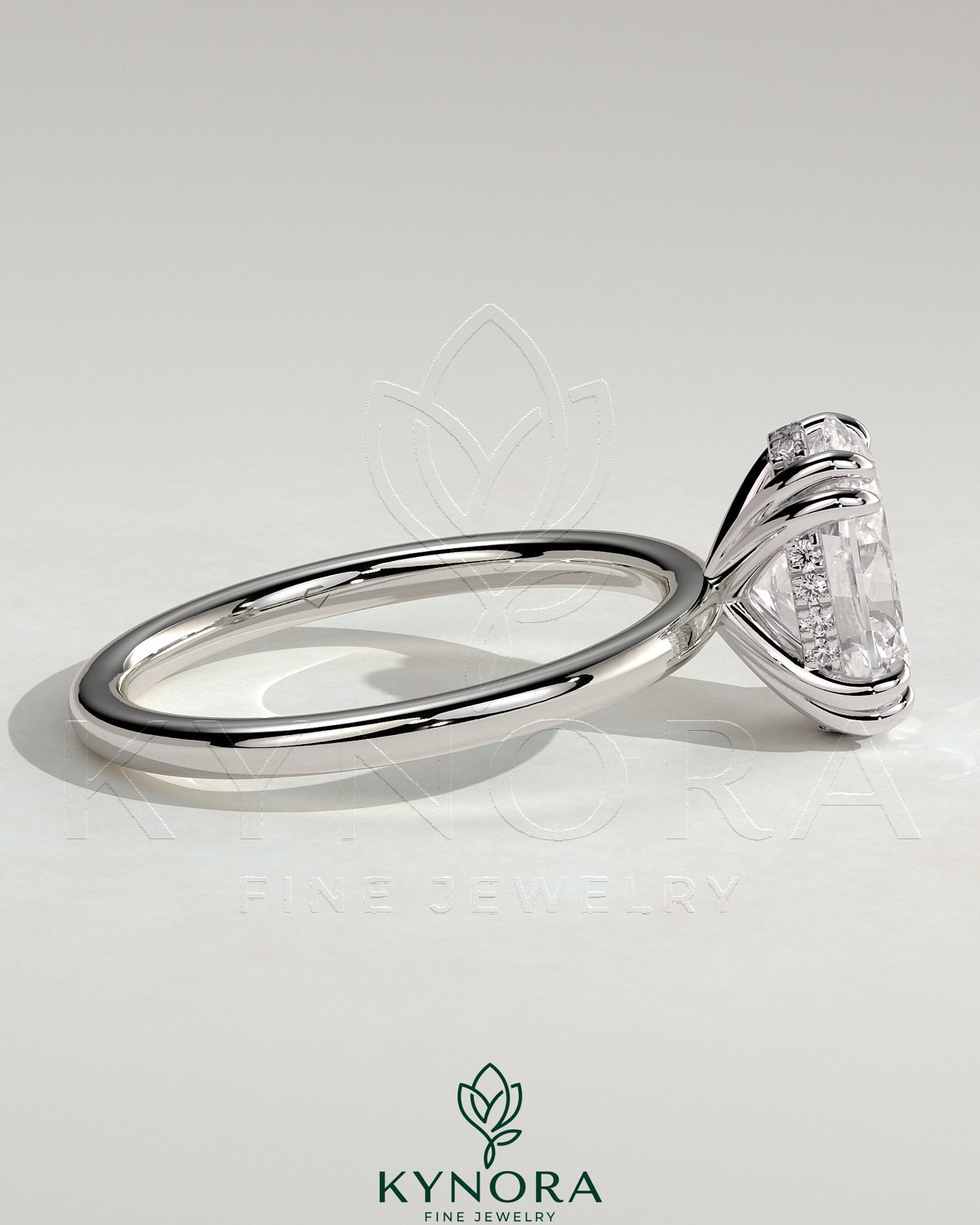 Kynora CJ 2ct oval double claw solitaire engagement ring with hidden halo, showcasing a sparkling center stone and elegant design.