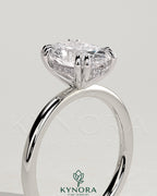 Kynora CJ 2ct oval double claw solitaire engagement ring with hidden halo, showcasing a sparkling oval diamond setting.
