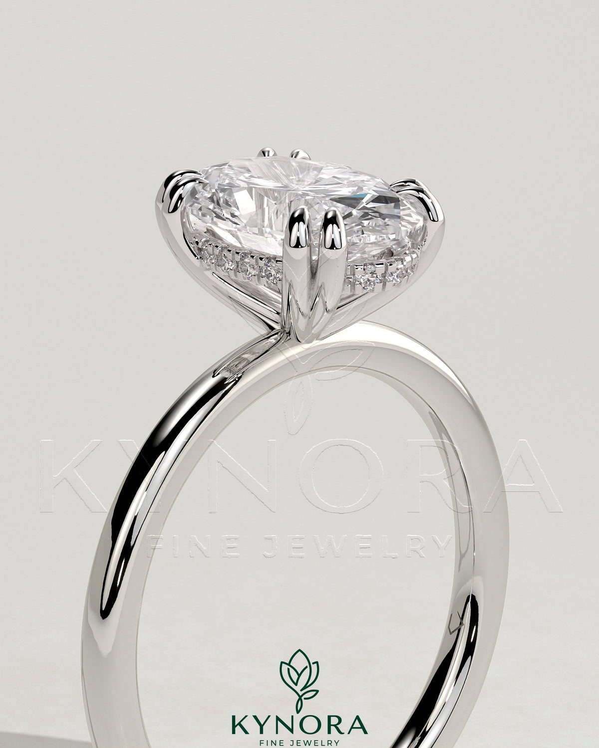 Kynora CJ 2ct oval double claw solitaire engagement ring with hidden halo, showcasing a sparkling oval diamond setting.