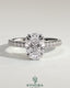 Kynora CJ 2ct oval double claw solitaire engagement ring with hidden halo, pave band, and cathedral high setting, showcasing intricate design.
