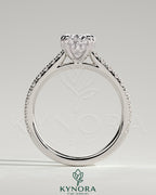 Kynora CJ 2ct oval double claw solitaire engagement ring with hidden halo, pave band, and cathedral high setting.