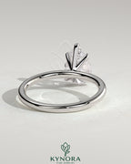 Kynora CJ 2ct pear-shaped diamond solitaire engagement ring with five prongs, showcasing elegant jewelry design.