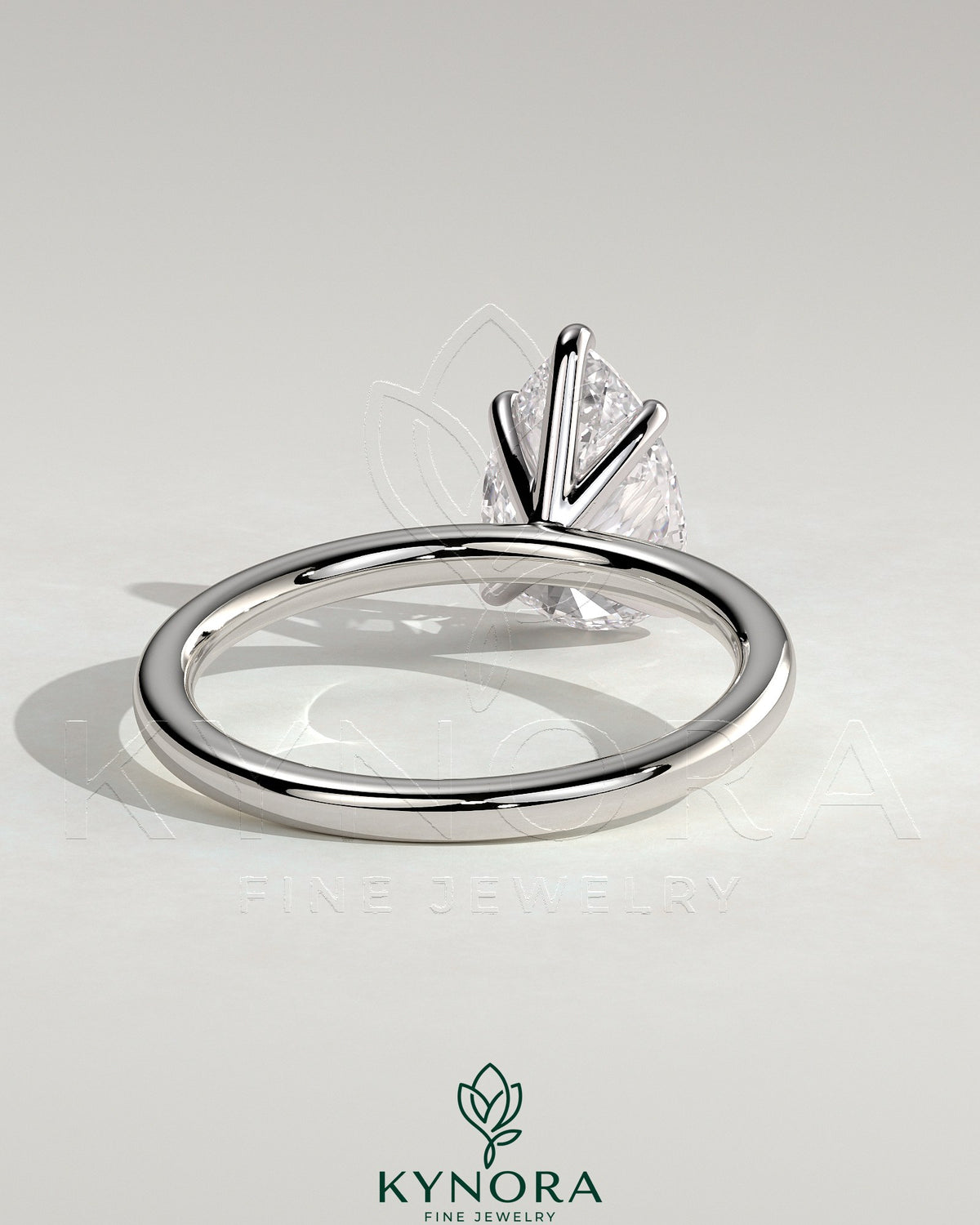 Kynora CJ 2ct pear-shaped diamond solitaire engagement ring with five prongs, showcasing elegant jewelry design.