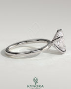 Kynora CJ 2-carat pear-shaped diamond solitaire engagement ring with five-prong setting on a sleek band.