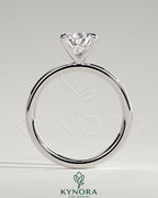 Kynora CJ 2ct pear-shaped diamond solitaire engagement ring with five prongs on a silver band.