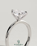 Kynora CJ 2ct pear-shaped diamond solitaire engagement ring with five prongs and a sleek band.