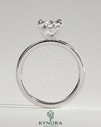Kynora CJ 2ct pear-shaped diamond claw solitaire engagement ring with three prongs, elegant and sparkling jewelry piece.