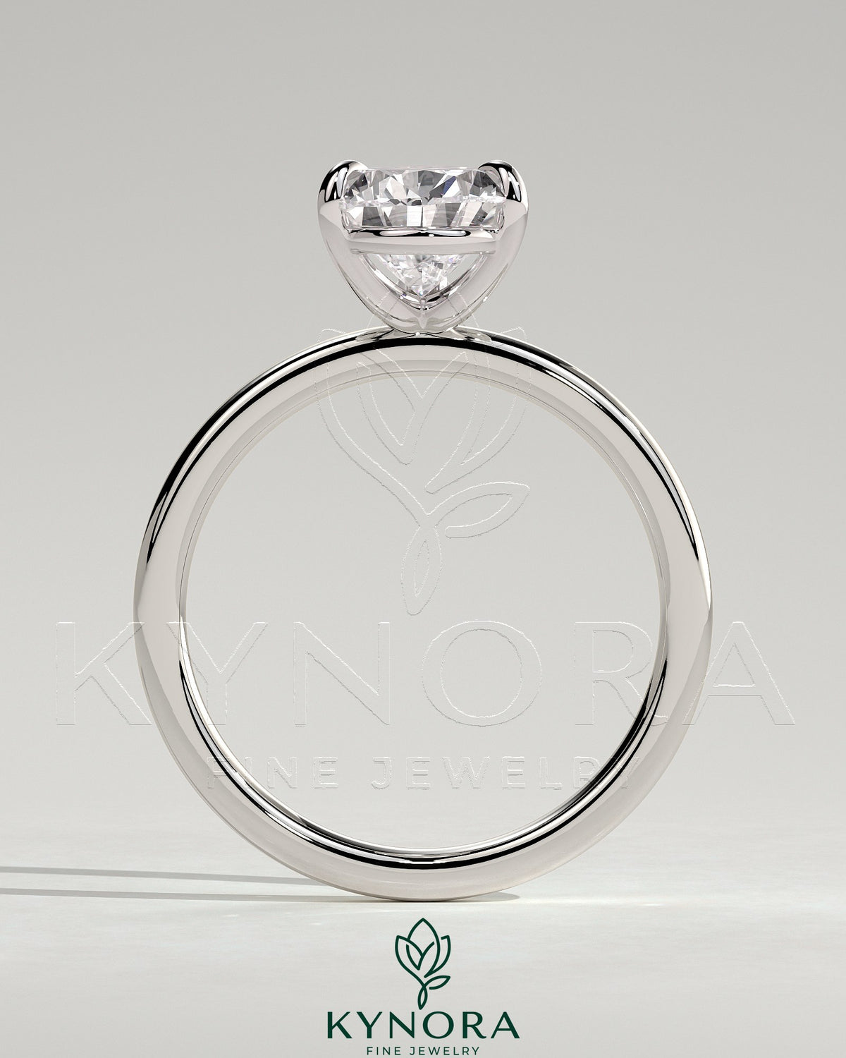 Kynora CJ 2ct pear-shaped diamond claw solitaire engagement ring with three prongs, elegant and sparkling jewelry piece.