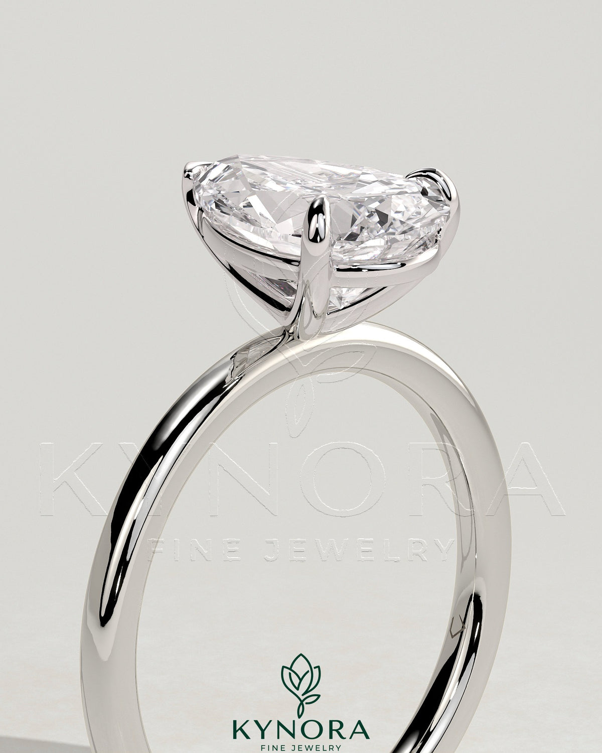 Kynora CJ 2ct pear-shaped diamond solitaire engagement ring with three-prong setting showcasing the elegant gemstone.