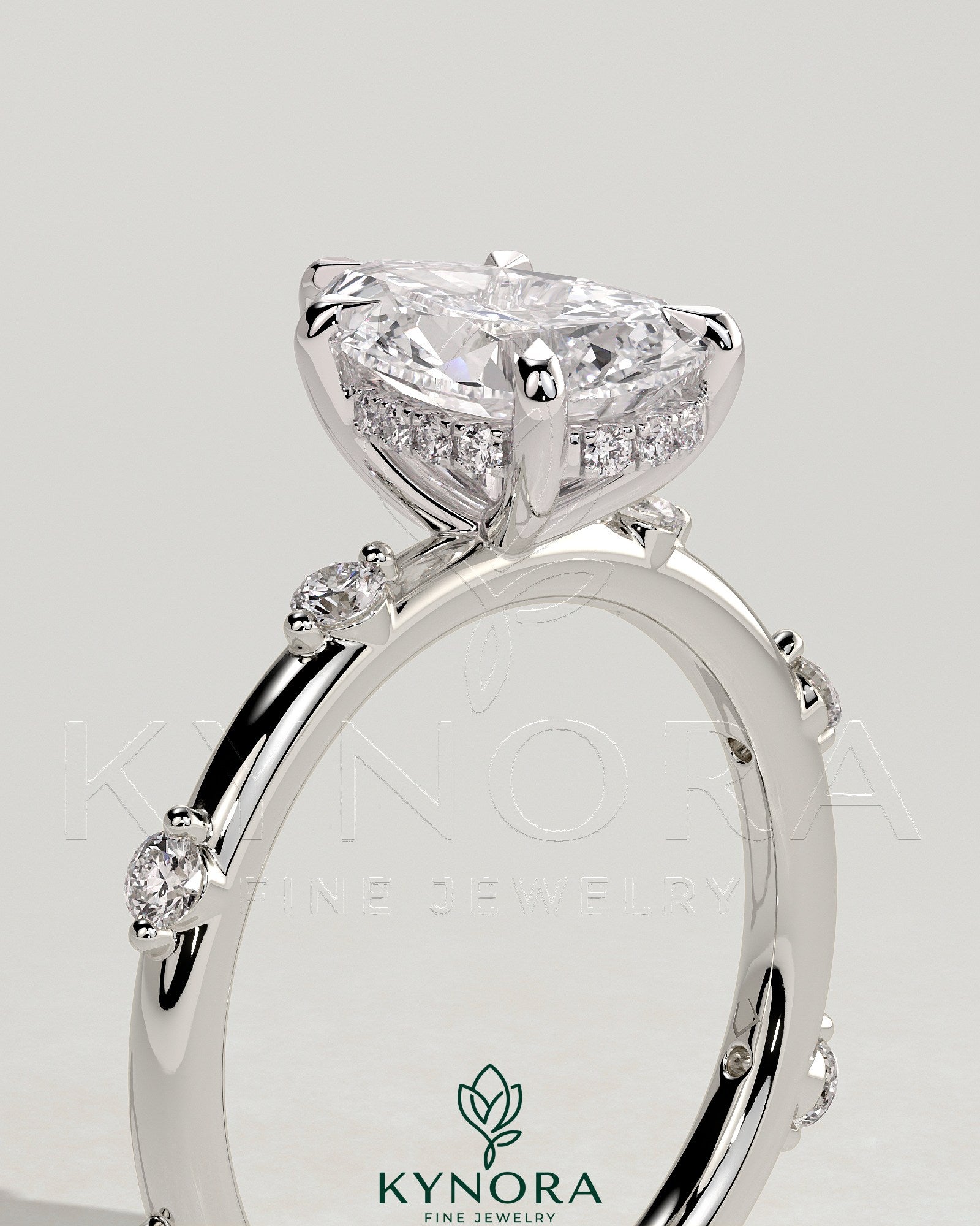 2ct Pear Claw Solitaire with 6 Spaced Round Accent Stones and Hidden Halo Engagement Ring Secondary image