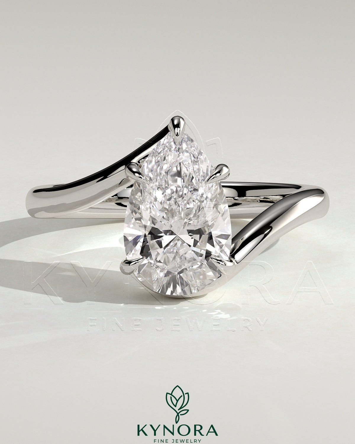 Kynora CJ 2ct pear-shaped diamond solitaire engagement ring with bypass band in sleek gold setting. Main image