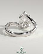 Kynora CJ 2ct pear-shaped diamond solitaire engagement ring with bypass band in elegant gold setting.