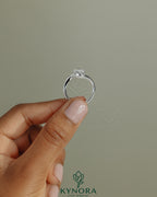 Kynora CJ 2ct pear-shaped diamond solitaire engagement ring with bypass band in sleek, elegant jewelry design.
