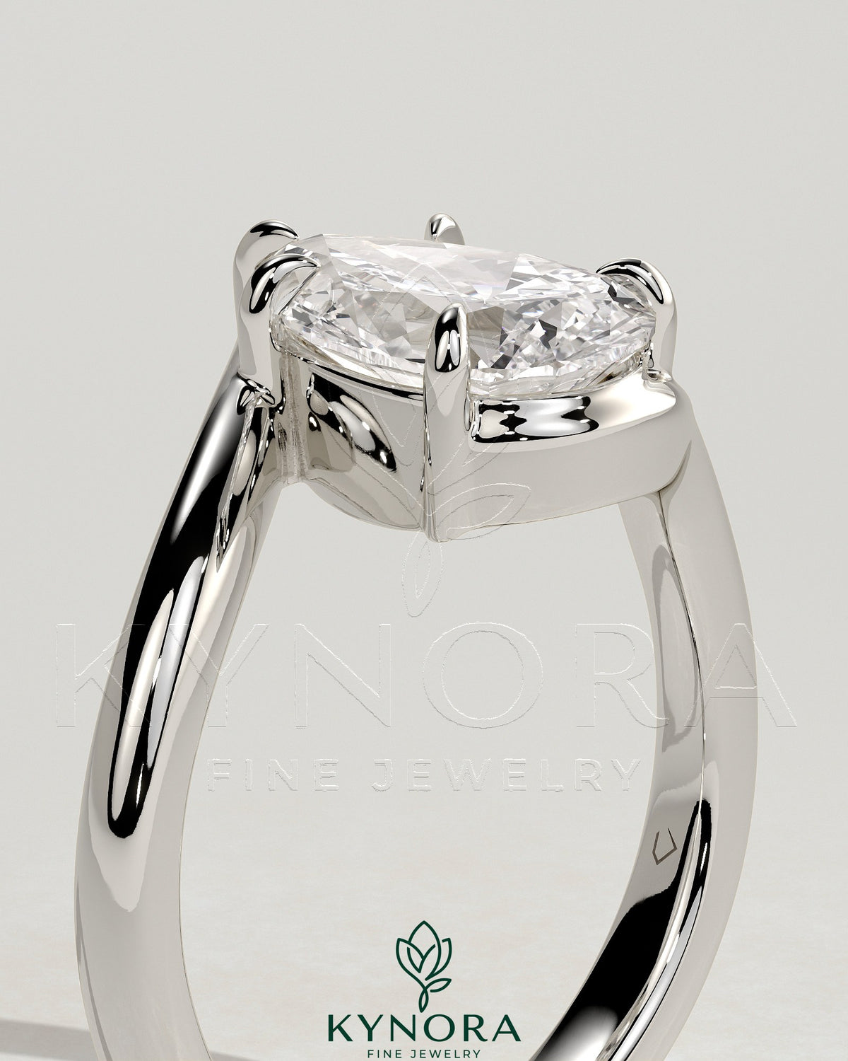 Kynora CJ 2ct pear-shaped diamond solitaire engagement ring with bypass band in platinum setting.