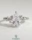 Kynora CJ 2ct pear-shaped diamond solitaire engagement ring with clustered round shoulder stones, crafted in sterling silver.