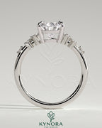 Kynora CJ 2ct pear-shaped diamond solitaire engagement ring with clustered round shoulder stones in a elegant jewelry setting