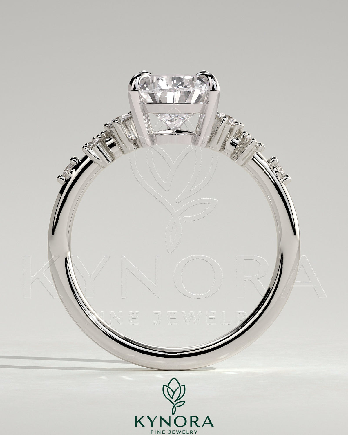 Kynora CJ 2ct pear-shaped diamond solitaire engagement ring with clustered round shoulder stones in a elegant jewelry setting
