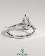 Kynora CJ 2ct pear-shaped moissanite solitaire engagement ring with hidden halo and cathedral high setting in sterling silver.