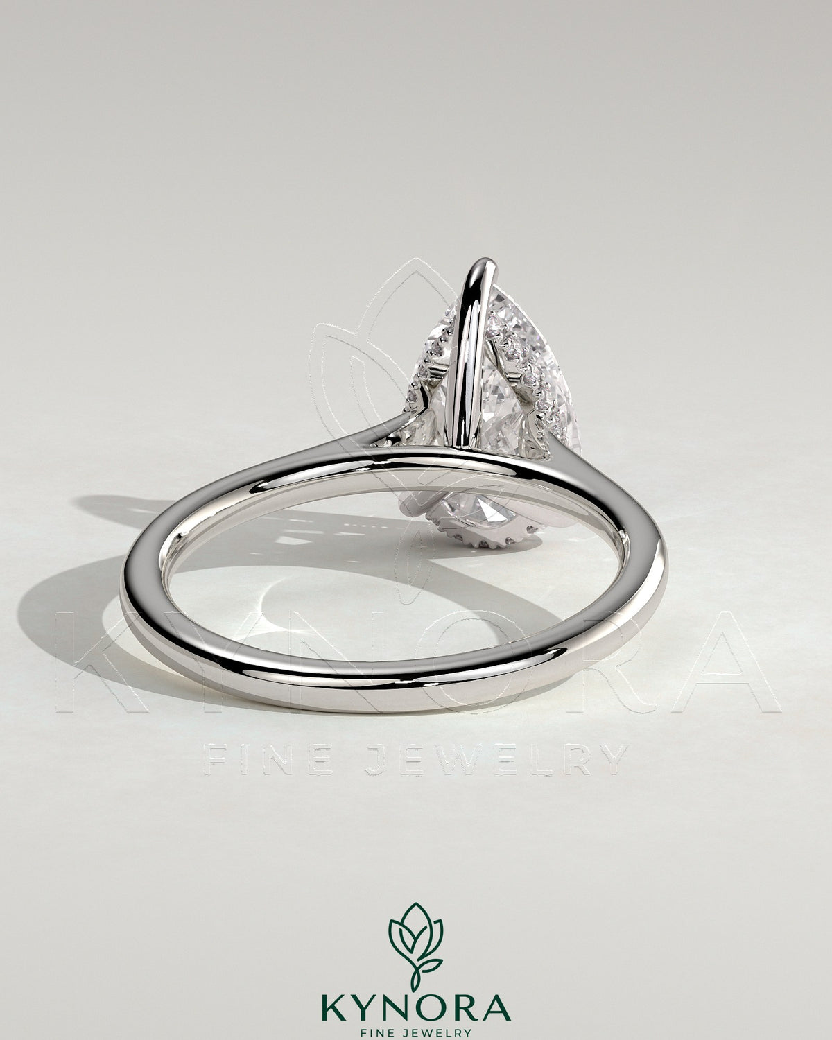 Kynora CJ 2ct pear-shaped moissanite solitaire engagement ring with hidden halo and cathedral high setting in sterling silver.