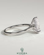 Kynora CJ 2ct pear-shaped moissanite solitaire engagement ring with hidden halo and cathedral high setting in sterling silver.