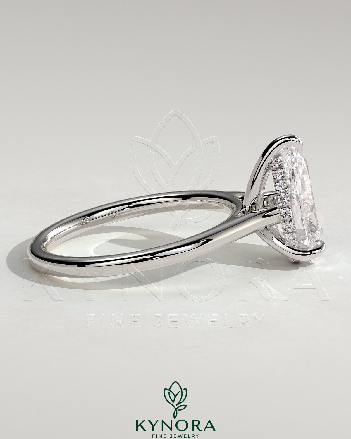 Kynora CJ 2ct pear-shaped moissanite solitaire engagement ring with hidden halo and cathedral high setting in sterling silver.