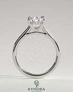 Kynora CJ 2ct pear-shaped moissanite solitaire engagement ring with hidden halo and cathedral high setting in sterling silver.