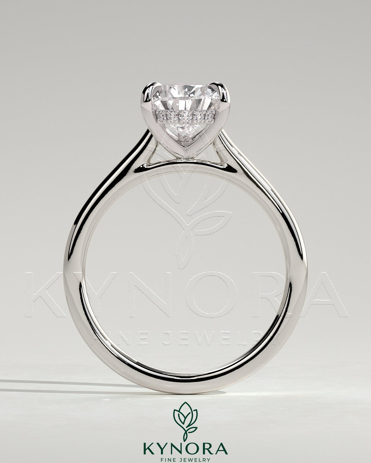 Kynora CJ 2ct pear-shaped moissanite solitaire engagement ring with hidden halo and cathedral high setting in sterling silver.