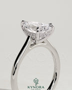 Sterling silver 2ct pear-shaped moissanite solitaire engagement ring with hidden halo and cathedral high setting by Kynora CJ