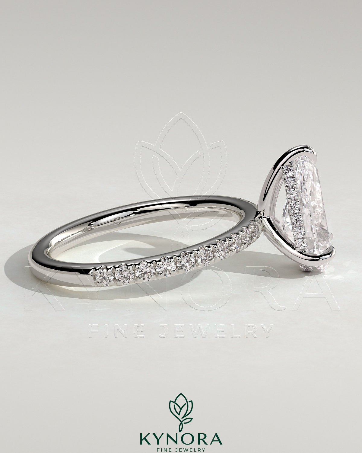 Kynora CJ 2ct pear-shaped diamond solitaire engagement ring with hidden halo and pave band, crafted in elegant jewelry design.