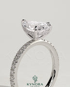 Kynora CJ 2ct pear-shaped diamond solitaire engagement ring with hidden halo and pave band, elegant jewelry for special occasions