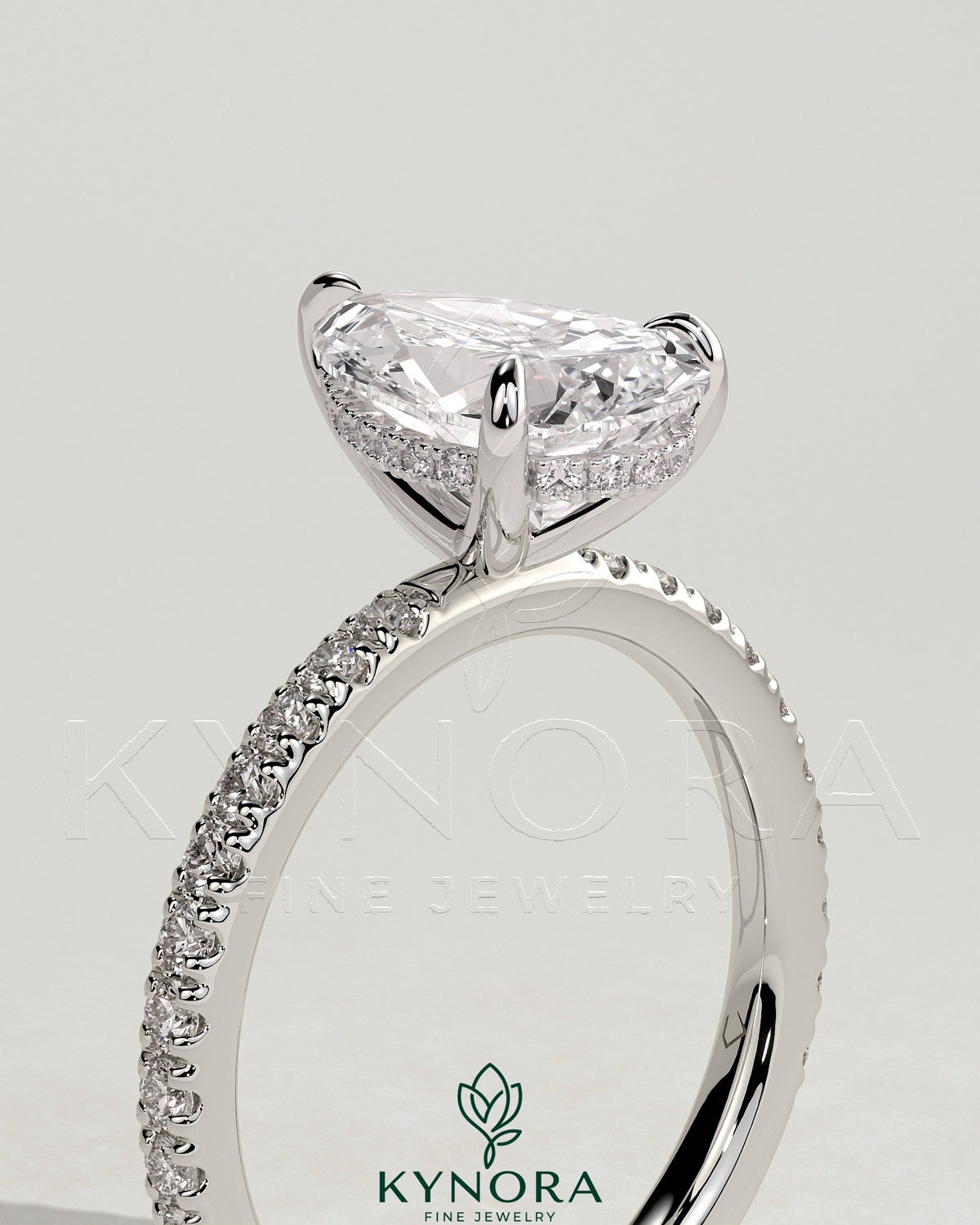 Kynora CJ 2ct pear-shaped diamond solitaire engagement ring with hidden halo and pave band, elegant jewelry for special occasions
