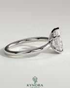 Kynora CJ 2ct pear-shaped diamond solitaire engagement ring with hidden halo setting, elegant and sparkling jewelry piece.