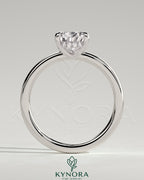 Kynora CJ 2ct pear-shaped diamond solitaire engagement ring with hidden halo, showcasing elegant jewelry design.