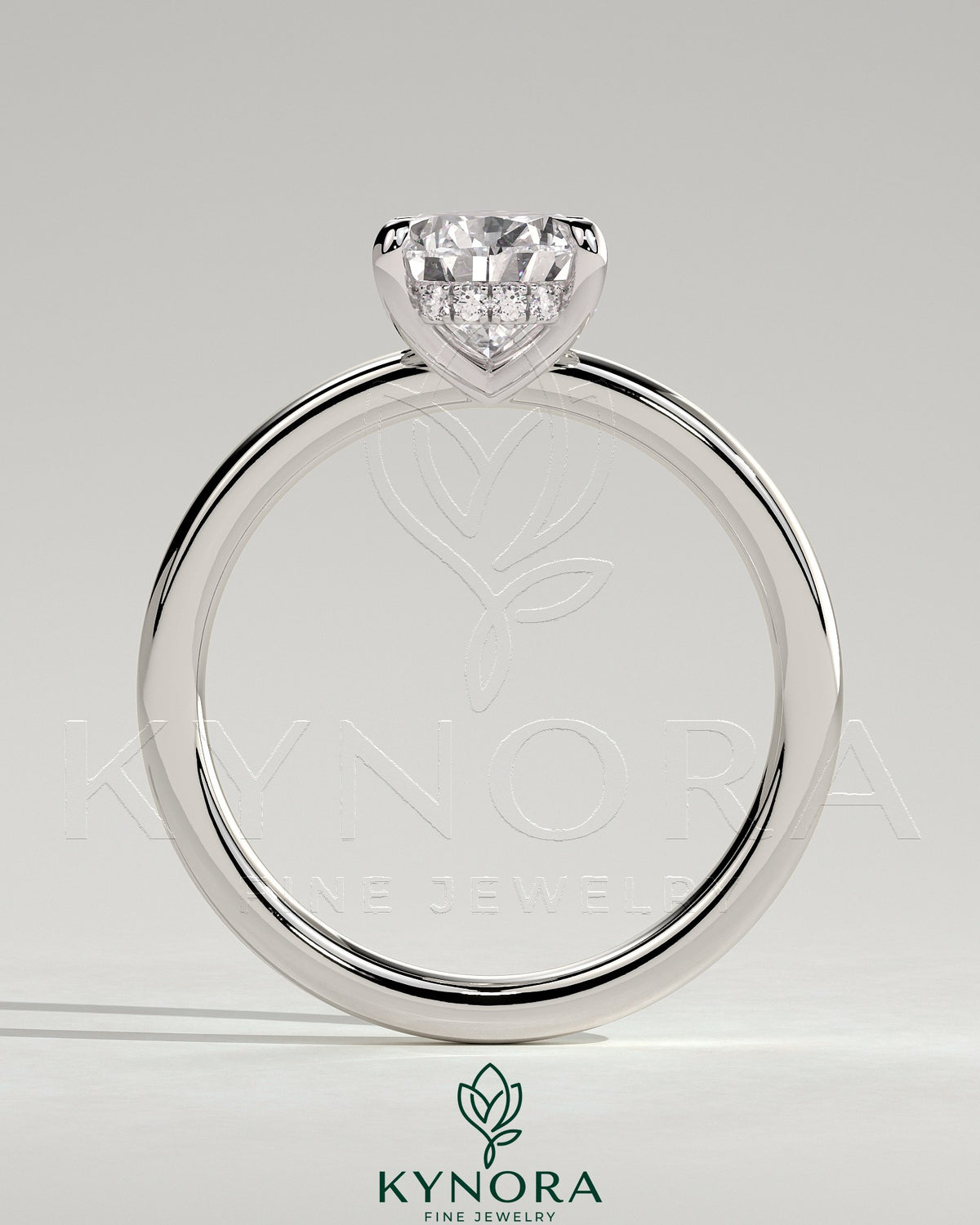 Kynora CJ 2ct pear-shaped diamond solitaire engagement ring with hidden halo, showcasing elegant jewelry design.