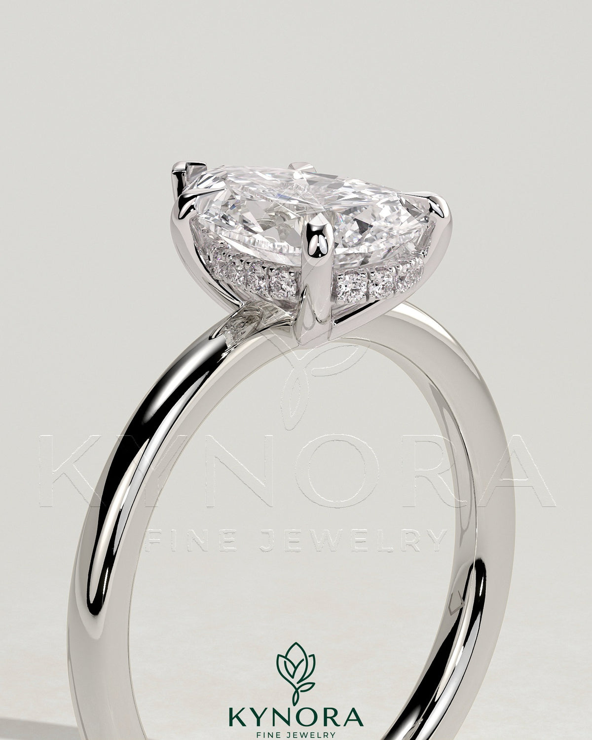 Kynora CJ 2ct pear-shaped diamond solitaire engagement ring with hidden halo and intricate band detail