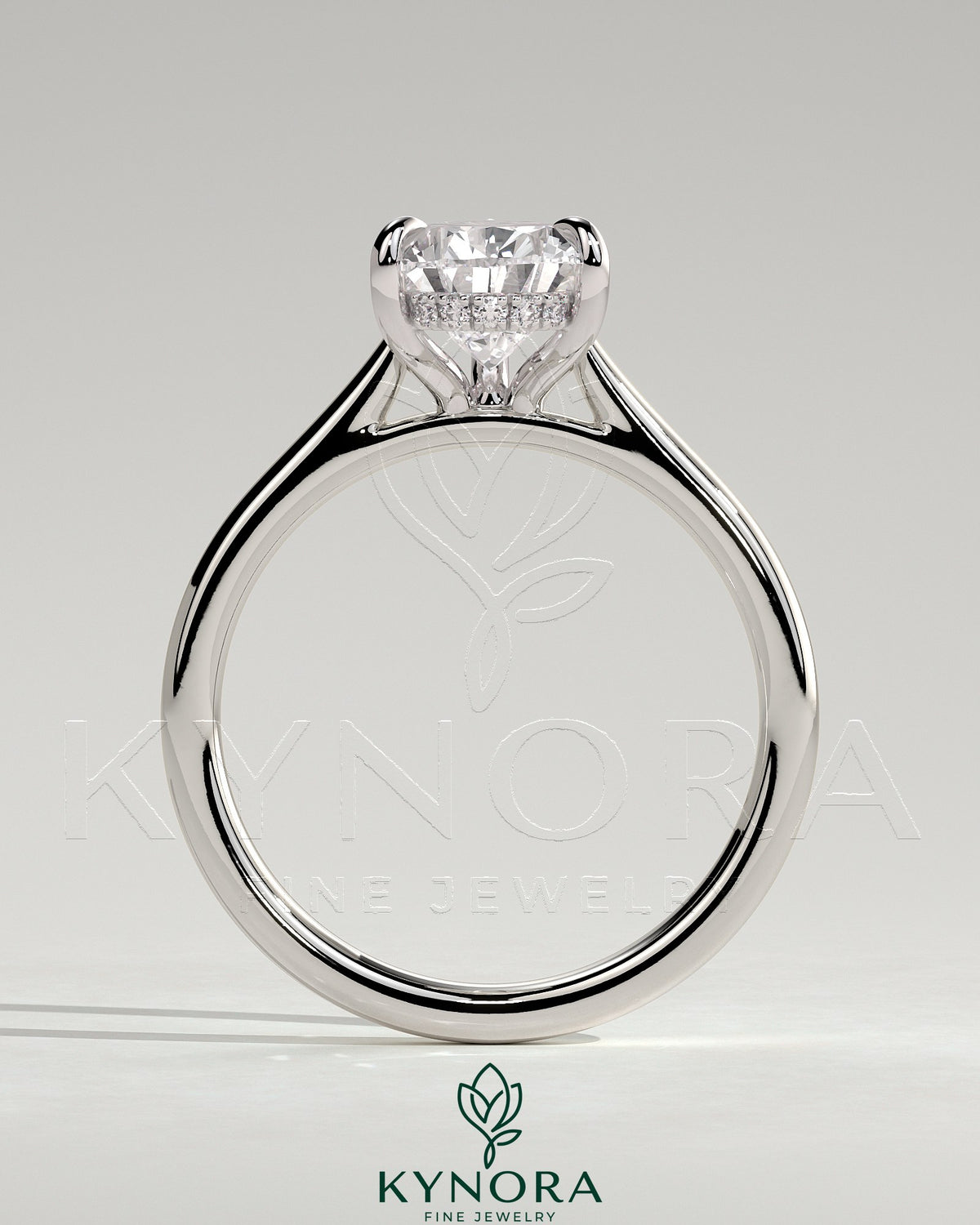 Kynora CJ 2ct pear-shaped diamond solitaire engagement ring with hidden halo, tapered band, and cathedral high setting.