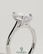 Kynora CJ 2ct pear-shaped diamond solitaire engagement ring with hidden halo, tapered band, and cathedral high setting.