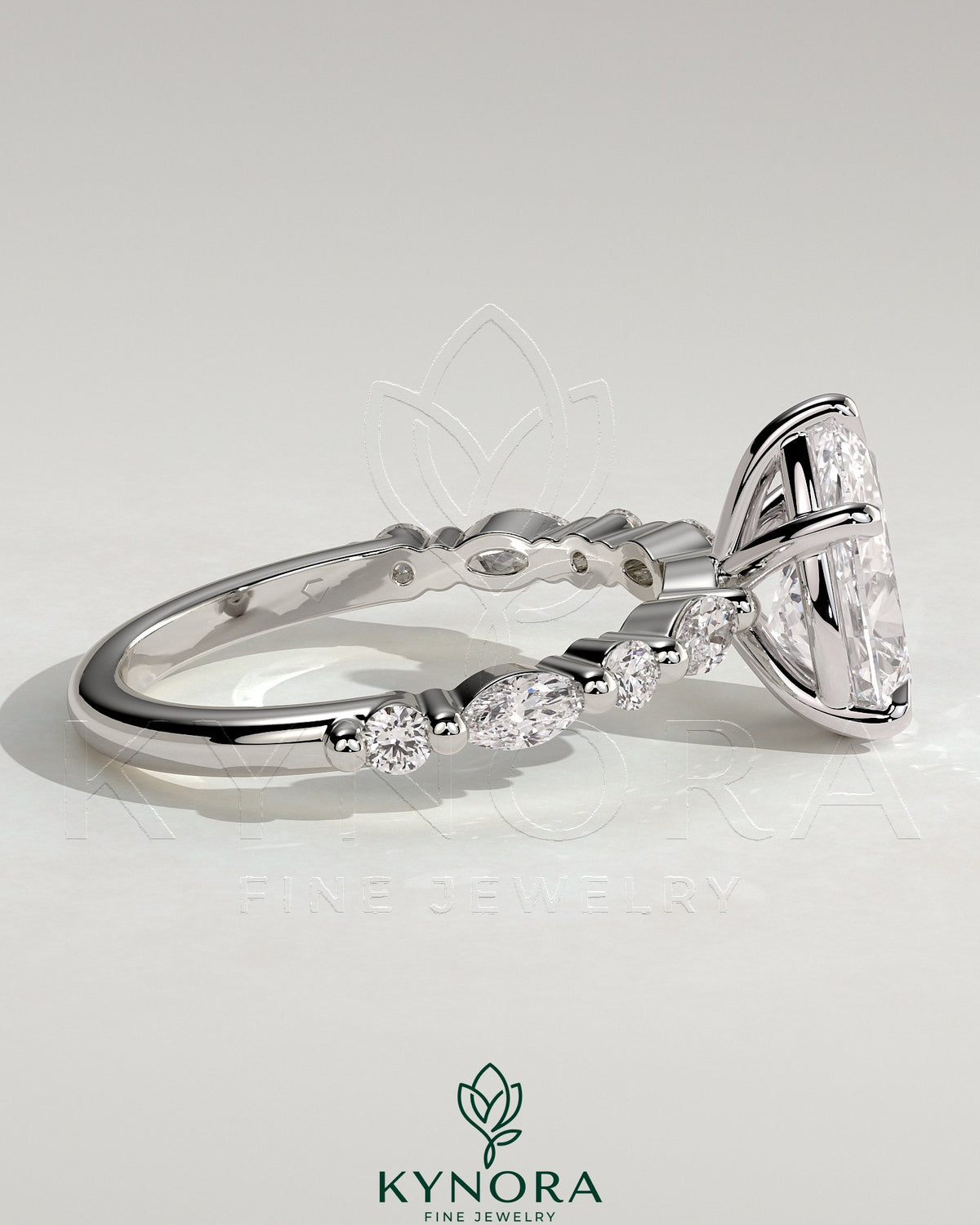 Kynora CJ 2ct pear-shaped diamond solitaire engagement ring with marquise and round accent stones, elegant and sparkling jewelry.