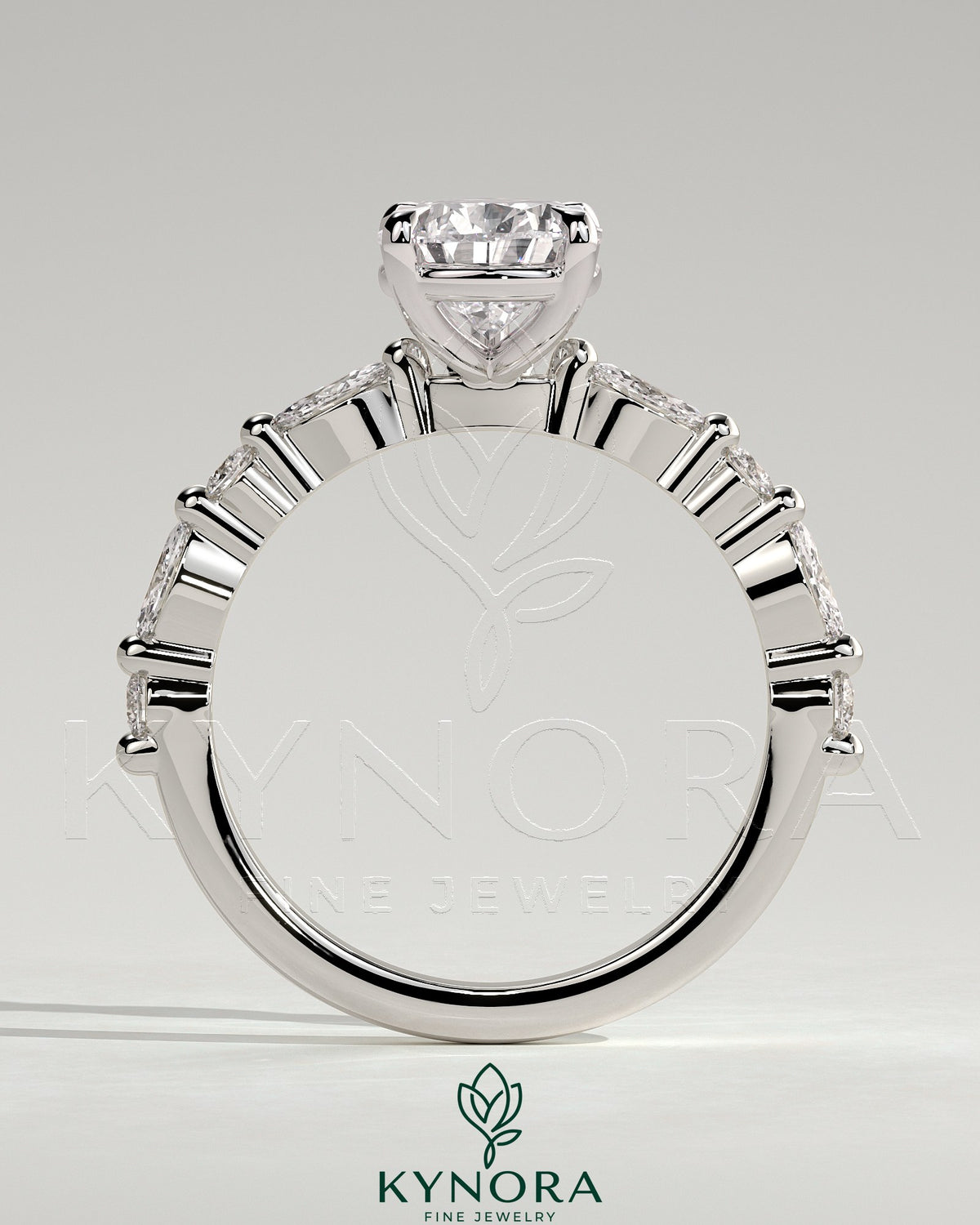 Kynora CJ 2ct pear-shaped diamond solitaire engagement ring with marquise and round accent stones, elegant and sparkling jewelry piece.