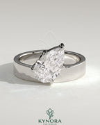 Kynora CJ 2ct pear-shaped diamond solitaire engagement ring with offset angled setting and flat cigar band design.