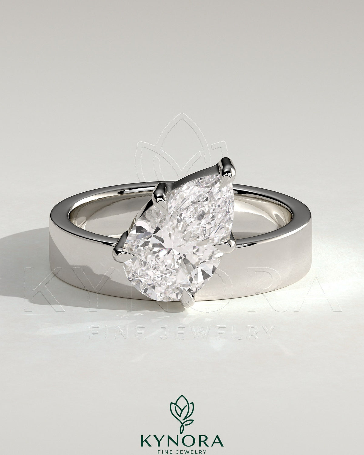 Kynora CJ 2ct pear-shaped diamond solitaire engagement ring with offset angled setting and flat cigar band design.