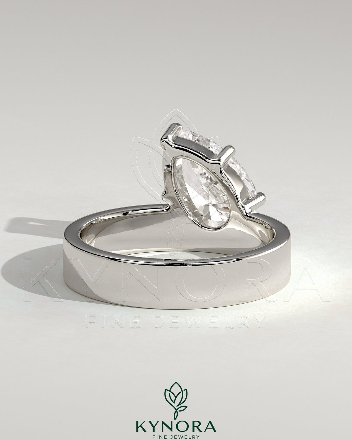 Kynora CJ 2ct pear-shaped diamond solitaire ring with offset setting and flat cigar band engagement ring in gold.