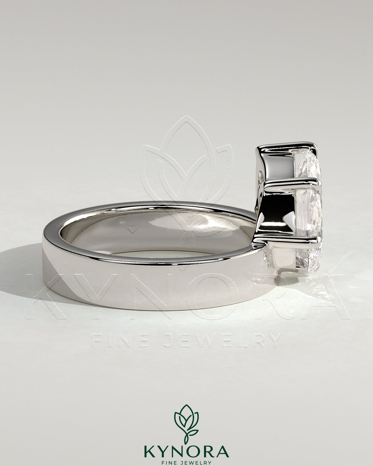 Kynora CJ 2ct pear-shaped diamond solitaire engagement ring with offset setting and flat cigar band in silver gold finish.