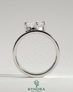 Kynora CJ 2ct pear-shaped diamond solitaire engagement ring with an offset angled setting and flat cigar band design.