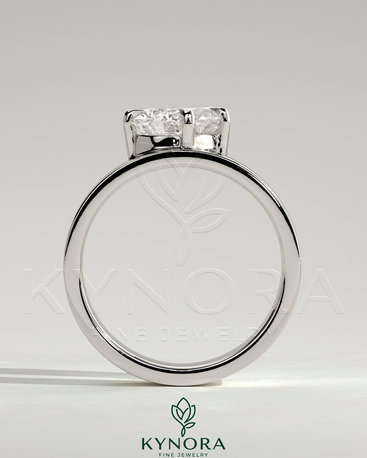 Kynora CJ 2ct pear-shaped diamond solitaire engagement ring with an offset angled setting and flat cigar band design.