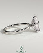 Kynora CJ 2ct pear-shaped diamond solitaire ring with petal gallery and accented tiara detail, elegant engagement ring.