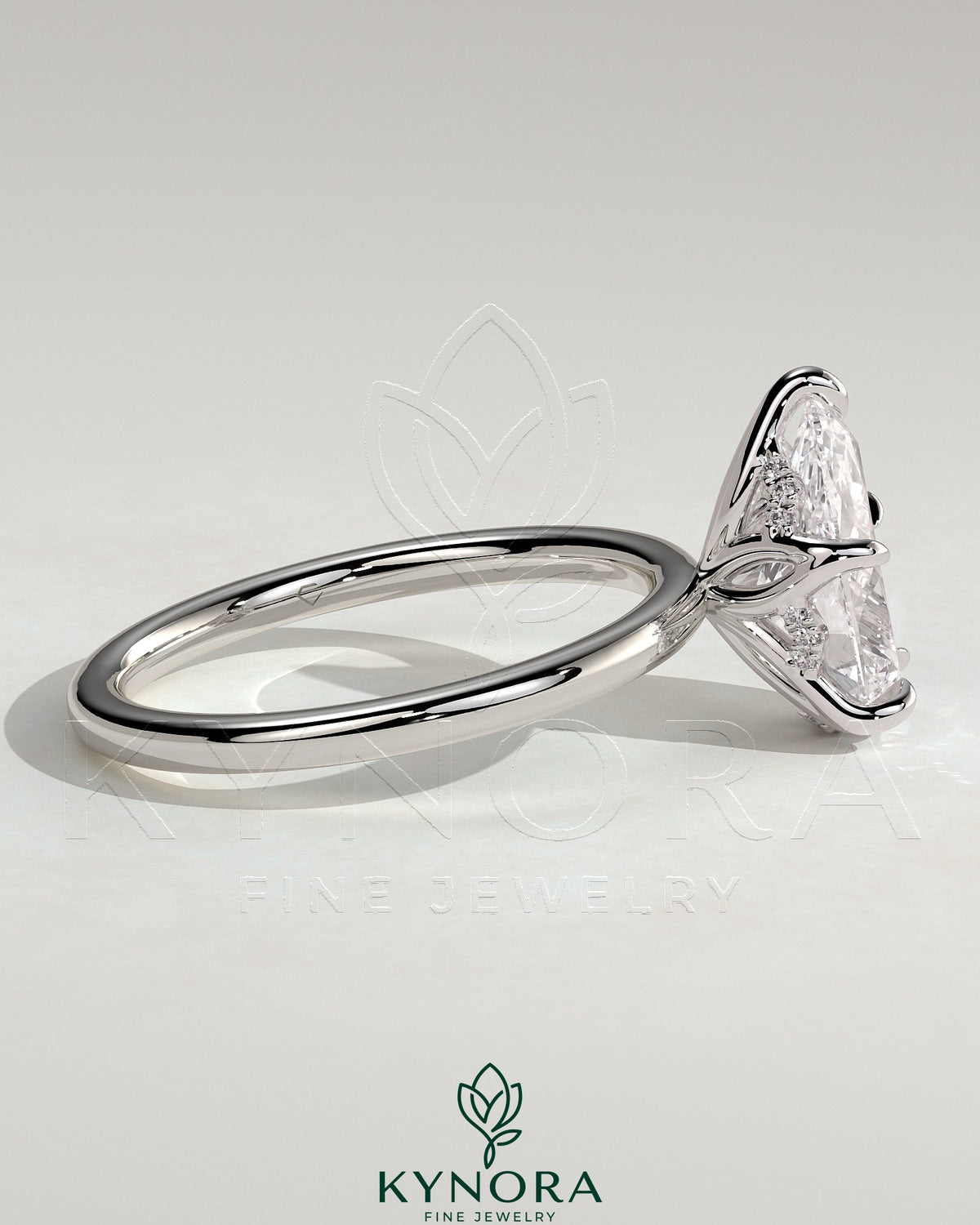 Kynora CJ 2ct pear-shaped diamond solitaire ring with petal gallery and accented tiara detail, elegant engagement ring.
