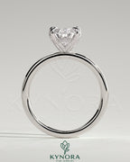 Kynora CJ 2ct pearl claw solitaire engagement ring with petal gallery and accented tiara detail, showcasing intricate craftsmanship.