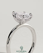 Kynora CJ 2ct pear-shaped diamond solitaire engagement ring with petal gallery and accented tiara detail.