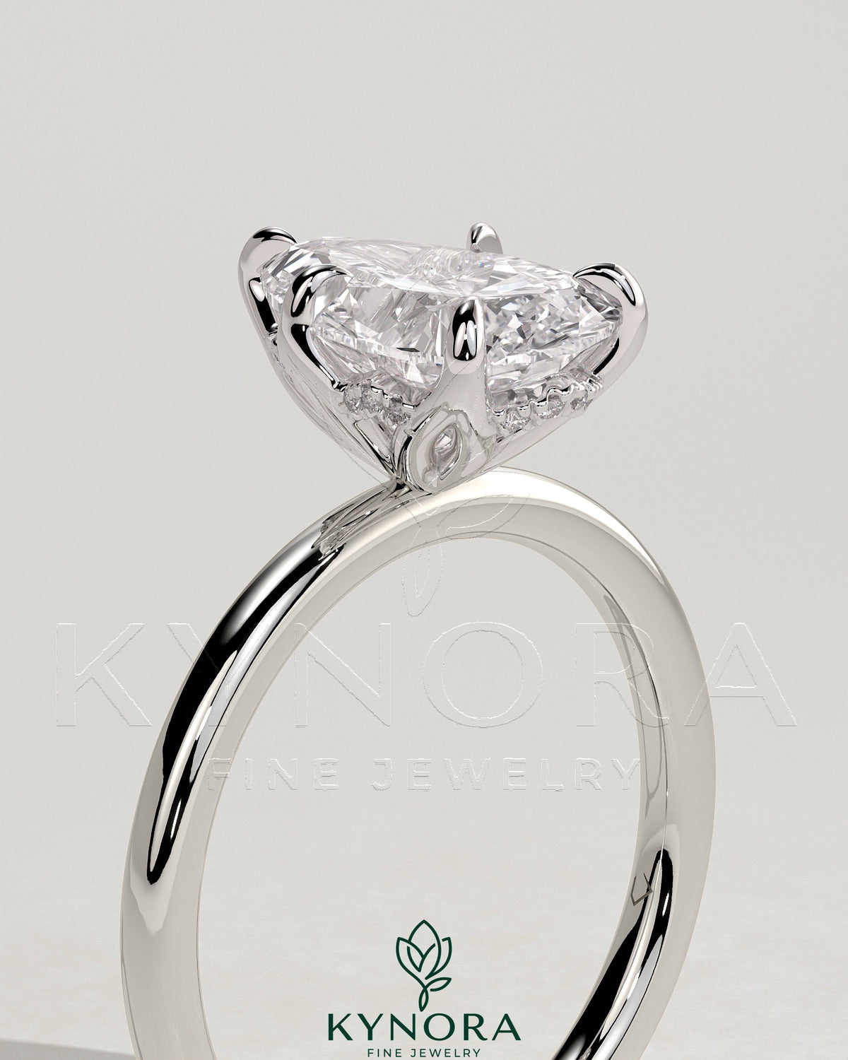 Kynora CJ 2ct pear-shaped diamond solitaire engagement ring with petal gallery and accented tiara detail.